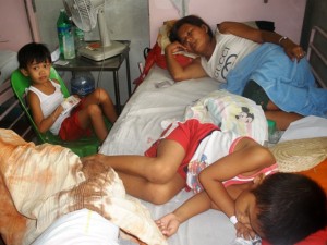 Typical scene in Philippine Hospital where there are people watching over the patient